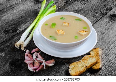 Soup Garlic With Toasted Croutons On Wood Table