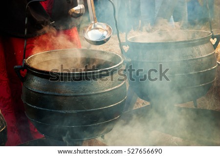 Soup and hot wine preparation at traditional Christmas Medieval fair in Provins (France). 