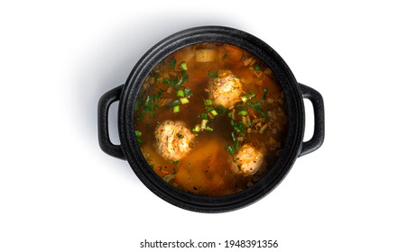 Soup With Meatballsi N A Black Pot Isolated On A White Background. 