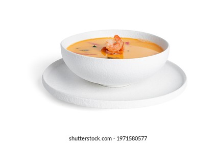 Soup With Shrimps In A White Deep Dish Isolated On A White Background. Thai Soup With Seafood. Thai Tom Yum Soup. High Quality Photo