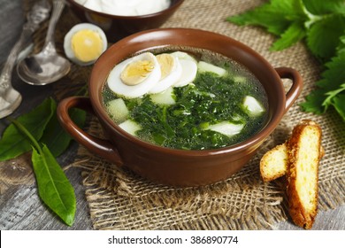Soup of sorrel and nettles on the table