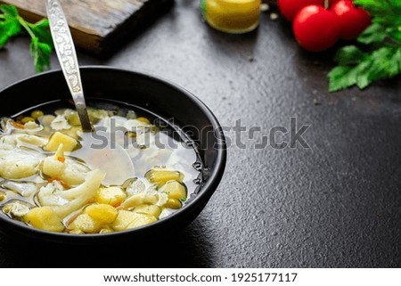 soup vegetable fine pasta first course broth, potatoe, cauliflower, onion, carrot, celery no meat vegetarian or vegan portion on the table meal snack top view copy space for text food background