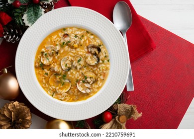 Soupy Rice With Clams Served On A Christmas Table. Traditional Spanish Seafood Soup Recipe.