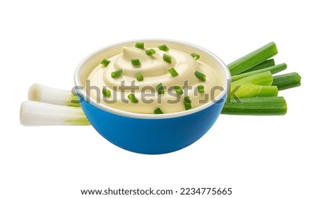 Sour cream with green onion isolated on white background