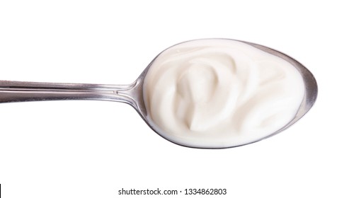 Sour Cream In Metal Spoon Isolated On White Background. Top View. Flat Lay