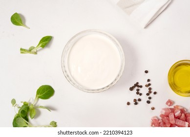 Sour Cream. Recipe. Raw Ingredients. Ready To Cook. Pepper. Oil. Bacon Bits. On The Kitchen Table. Seen From Above. Healthy Food. Nutrition. Mediterranean Food. Italian Meal. White Background.