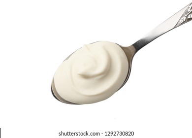 Sour Cream In Spoon Isolated On White Background