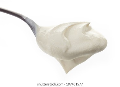 Sour Cream In A Spoon On White Background