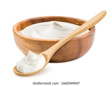 sour cream in wooden bowl and spoon, mayonnaise, yogurt, isolated on white background, clipping path, full depth of field - Shutterstock ID 1660349047