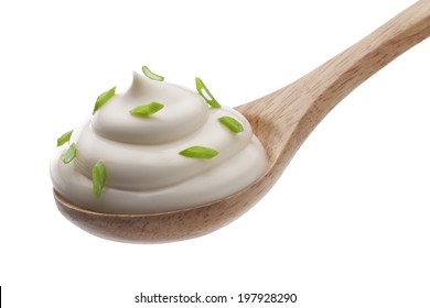 Sour Cream In Wooden Spoon Isolated