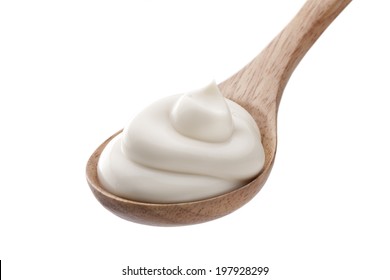 Sour Cream In Wooden Spoon Isolated