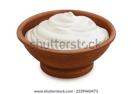 sour cream or yogurt in ceramic bowl isolated on white background with full depth of field