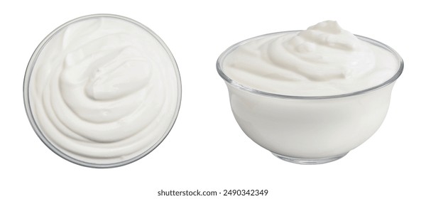 sour cream or yogurt in glass bowl isolated on white background with full depth of field. Top view. Flat lay