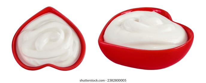 sour cream or yogurt in red ceramic bowl heart shaped isolated on white background with full depth of field. Top view. Flat lay - Powered by Shutterstock