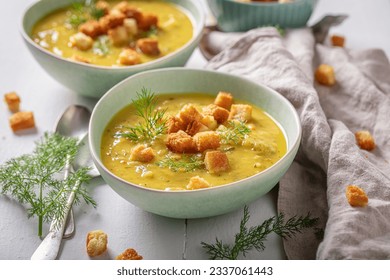 Sour gherkins soup with dill and croutons. Minestrone soup with mix of vegetables.