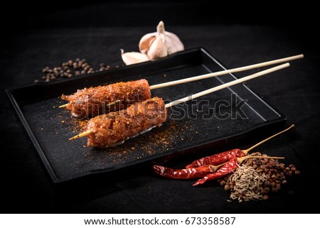 sour pork mala grilled on table with blackground (selective focusing)