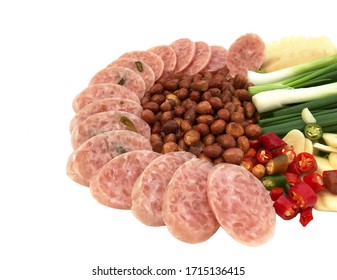 Sour Pork, Thai Eastern Sausage Traditional Style Food Appetizer. Sliced Fermented Sour Pork Sausage Served With Peanuts, Chilli, Garlic, And Spring Onion Isolated On White Background With Copy Space.