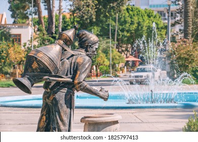 A source of clean drinking water in Antalya etched in the style of an ancient water carrier sculpture with water jugs and a fountain in the background