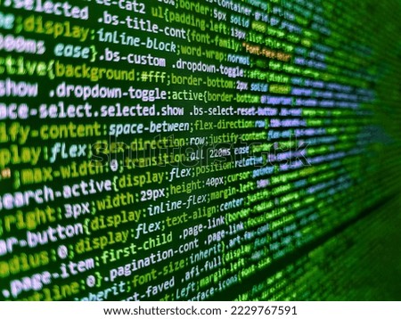 Source code close-up. Programmer typing new lines of HTML code. Binary Screen Background, Petya Virus. Blurred Digital Data Transfer Network concept. Abstract source code background. Modern tech