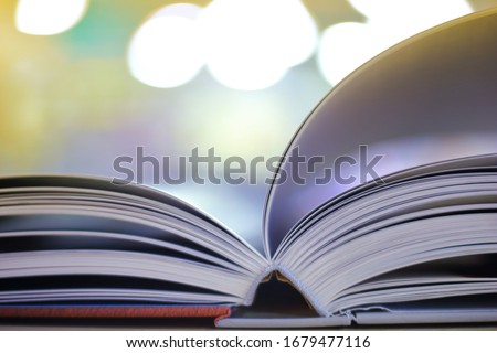 source of knowledge, open book on a blurred background.
