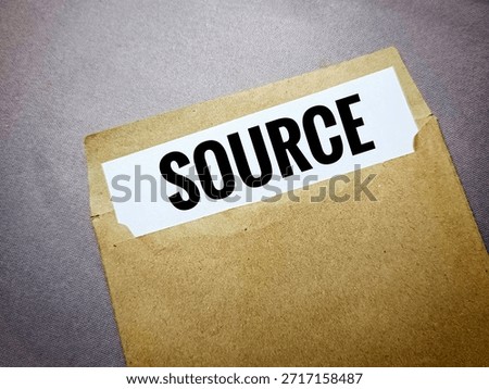 Source on paper in brown envelope representing document management, information handling, records, correspondence, and office organization concept. 