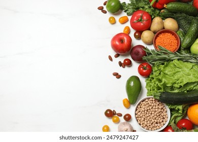 Source of protein for vegetarians. Different fresh vegetables, fruits and herbs on white marble table, space for text - Powered by Shutterstock