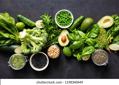 Source of protein for vegetarians. Top view healthy food clean eating: vegetable, seeds, superfood, leaf vegetable on dark background - Powered by Shutterstock