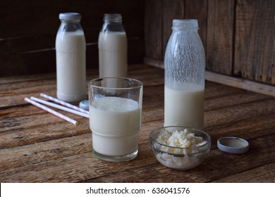 Sour-dairy Drink Or Yoghurt In Bottle That Come From The Kefir Grains And Milk On Wooden Background. Photographed With Natural Light