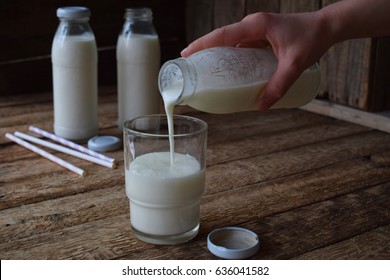 Sour-dairy Drink Or Yoghurt In Bottle That Come From The Kefir Grains And Milk On Wooden Background. Photographed With Natural Light