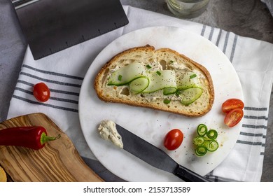 Sourdough Slice With Homemade Cream Cheese And Cucumber Slices