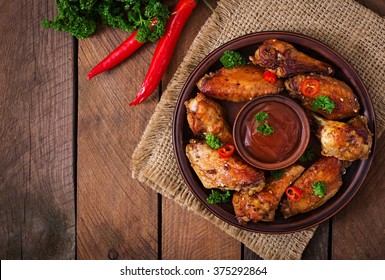 Sour-sweet Baked Chicken Wings And Sauce. Top View