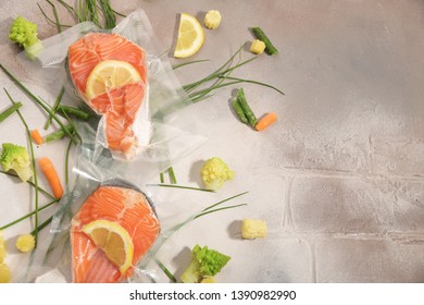 Sous Vide cooking concept. Vacuum packed ingredients arranged on light background. Top View.
