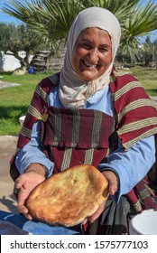 Sousse, Tunisia -  8 November 2019: Old Lady Baking A Traditional Arab Bread At Sousse In Tunisia