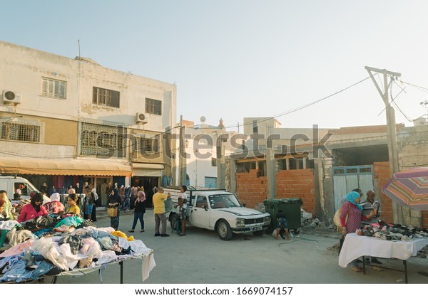 Sousse,\
Tunisia- August 2019: Sale and purchase of various goods on the\
open market on a city street. Medina in\
Sousse