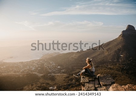 South africa- cape town- kloof nek- woman sitting on rock at sunset Stock photo © 