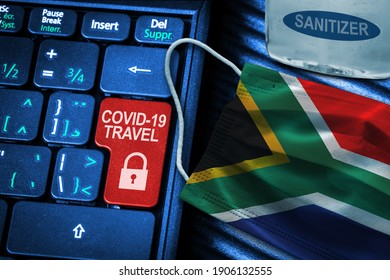 South Africa COVID-19 Coronavirus Travel Restrictions Concept Showing Red Button Warning On Keyboard With South African Flag Face Mask And Hand Sanitizer. New Normal In Global Travel.