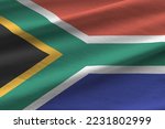 South Africa flag with big folds waving close up under the studio light indoors. The official symbols and colors in fabric banner