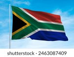 south africa flag waving in blue sky