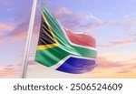 South Africa national flag blowing with mast. The flag waving in beautiful sky. South Africa national flag for independence day.