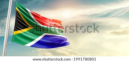 South Africa national flag waving in beautiful sunlight.