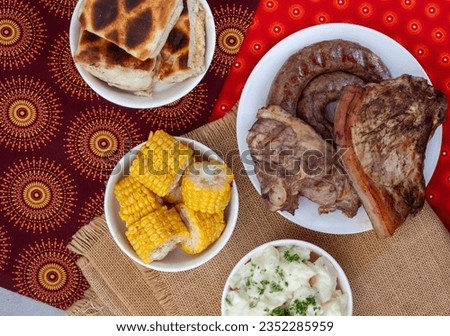 South African Braai Day or Heritage Day. Celebrating traditional braai food.
Meat and sides with traditional Shwe - Shwe cloth.
