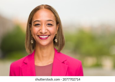 South African Businesswoman CEO Headshot In Blurry Background. Millennial Woman Entrepreneur