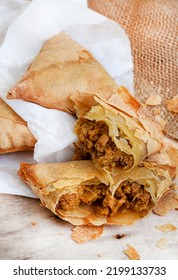 South African Chicken Samosas On Mottled Grey With Copy Space