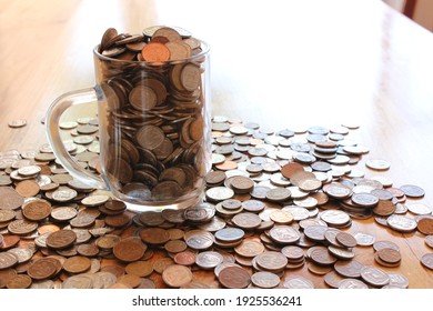 South African Silver and Copper coins spilling out of a glass beer mug - Shutterstock ID 1925536241