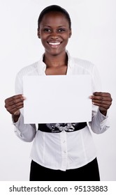 South AFrican Woman Holding Up A Blank Paper For Copyspace.