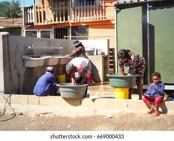 South Africans Family Washing In The Township Or Cape Flats Of Stellenbosch,Cape Town,South Africa , Slum At 17 Nov 2017.