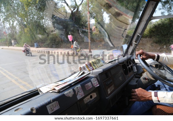 South Asia / India -\
February 2020: Gulistan Tourism Complex,hands of an Indian driver\
driving a minibus