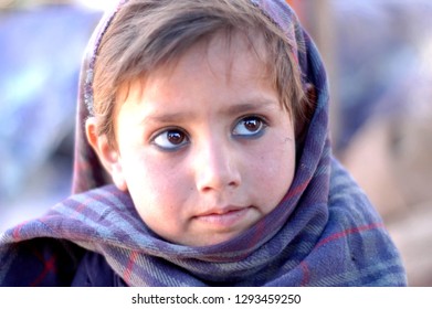 South Asian Beautiful Child With Beautiful Eyes In  Waziristan Waiting For Your Help.