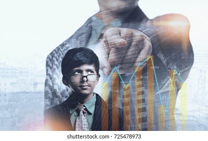 South Asian Child - Buisness Man Thinking And Pointing Towards Graph, Cityscape And Buildings In The Background