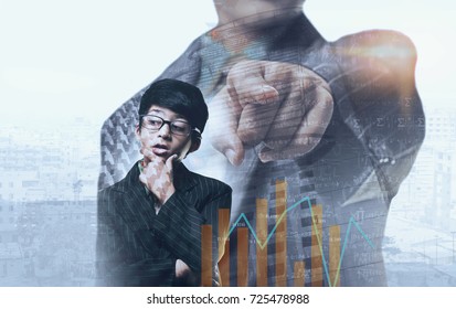 South Asian Child Buisness Man Thinking And Pointing Towards Graph, Cityscape And Buildings In The Background